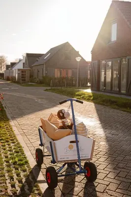 a cart with a teddy bear in it on a street at Relaxen aan de kust by Droomvilla in Sint Maarten