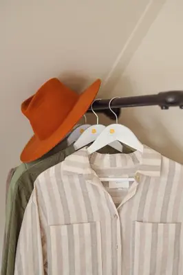 a cowboy hat and a shirt on a hanger at Buiten aan zee by Droomvilla in Sint Maarten