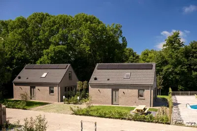two houses with solar panels on their roofs at Slapen aan zee by Droomvilla in Sint Maarten