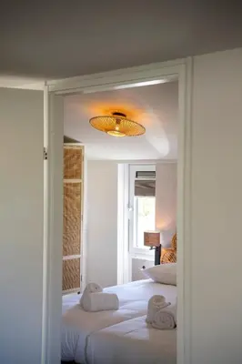 a bedroom with two beds with towels on them at Hip in Sint Maarten by Droomvilla in Sint Maarten