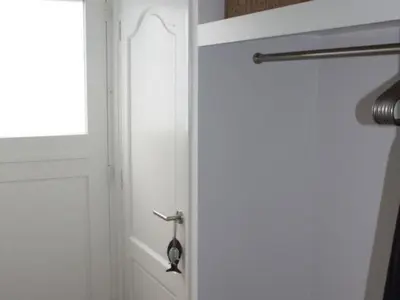 a white door with a handle and a window at Riverside holiday home near Amsterdam in Nigtevecht