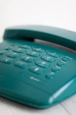 a blue calculator sitting on top of a table at Hotel Doria in Amsterdam