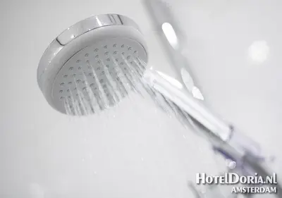 a close up of a shower head in a sink at Hotel Doria in Amsterdam