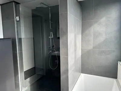 a bathroom with a shower and a sink at De Wielen 58 in Sint Maarten