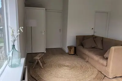 a living room with a couch and a table at Country house between Egmond aan Zee & Amsterdam in Castricum