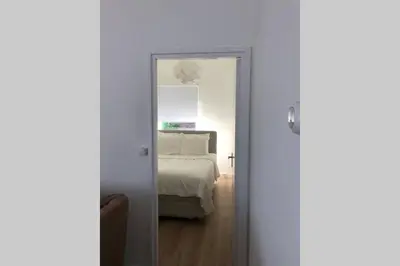 a door leading to a bedroom with a bed at Country house between Egmond aan Zee & Amsterdam in Castricum