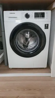 a white washing machine sitting in a room at Country house between Egmond aan Zee & Amsterdam in Castricum