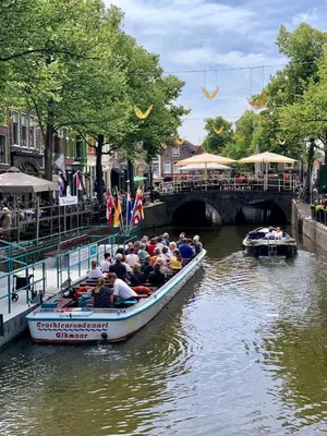 a group of people riding in a boat on a river at Cosy appartment in Alkmaar