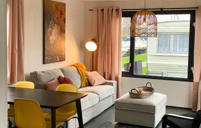 a living room with a couch and a table at 2 Bedroom Lovely Home In Breukelen in Breukelen
