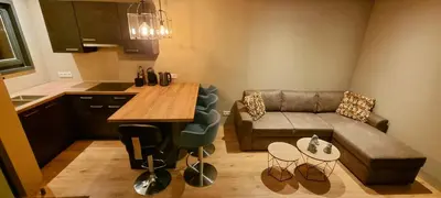 a small living room with a couch and a table at Inntermezzo in Almere