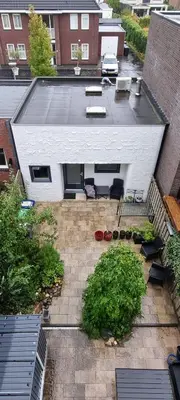 an aerial view of a backyard with a patio at Inntermezzo in Almere