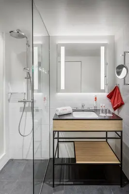 a bathroom with a sink and a shower at IntercityHotel Amsterdam Schiphol Airport in Hoofddorp