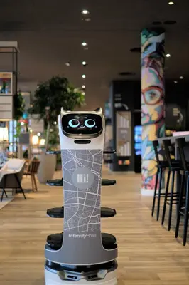 a cell phone on a stand in a store at IntercityHotel Amsterdam Schiphol Airport in Hoofddorp