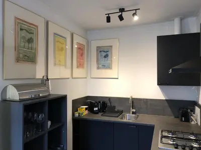 a kitchen with a sink and a counter top at Thomasloft in Oegstgeest