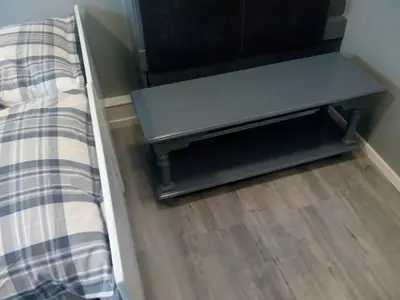 a bed with a bench next to a wooden floor at ALDO, not for parties, not a hotel, room with shared bathroom, no kitchen in Amsterdam