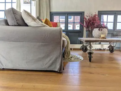 a living room with a couch and a coffee table at LaneStay DamSquare in Amsterdam