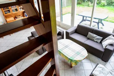 an overhead view of a living room with a couch and a table at Bungalow 40 op Recreatiepark De Wielen in Sint Maarten