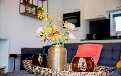 a vase with flowers in it on a table at Gorgeous Home In Breukelen With Wifi in Breukelen