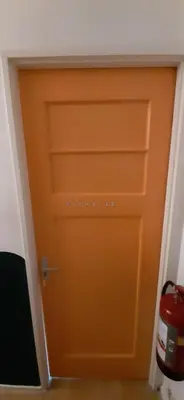 an orange door with the words historics on it at MICHELLE, not for parties, not a hotel, room with shared bathroom, no kitchen in Amsterdam