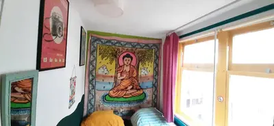 a room with a painting of a buddha on the wall at MICHELLE, not for parties, not a hotel, room with shared bathroom, no kitchen in Amsterdam