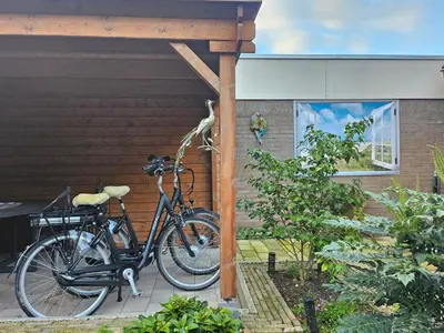 two bikes parked on the side of a house at bnbheerhugowaard in Heerhugowaard
