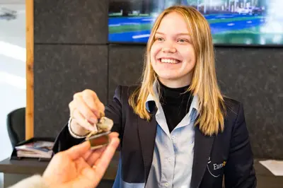 a woman is holding a object in her hand at EuroParcs Het Amsterdamse Bos in Amstelveen