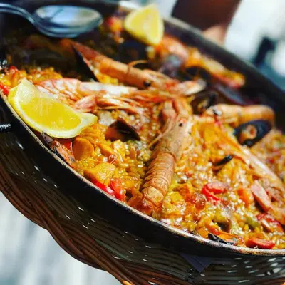 a dish of food with lobster and lemon slices at VILLA CALMA Rust Ruimte Luxe inclusief private jacuzzi in Zeewolde