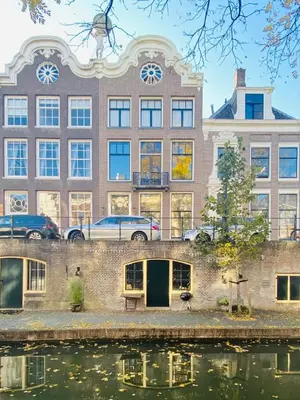 a large building next to a body of water at Vlinder's in Utrecht
