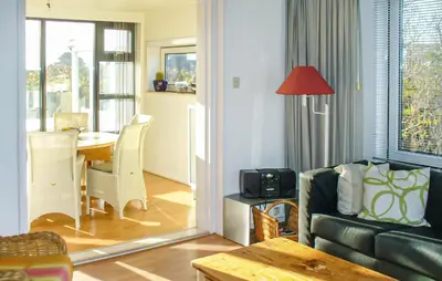 a living room with a couch and a table at Bellevue in Bergen aan Zee