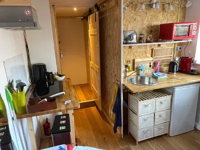 a small kitchen with a sink and a counter at Studio 7 in Hoogland