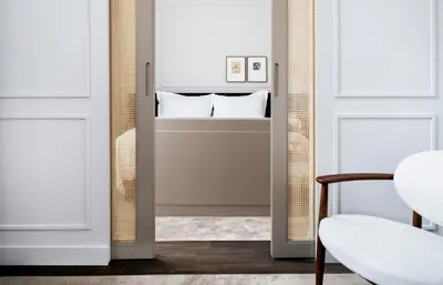 a mirror in a room next to a door at Pillows Grand Boutique Hotel Maurits at the Park - Small Luxury Hotels in Amsterdam