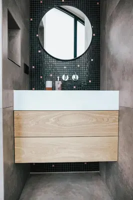 a bathroom with a large sink and a mirror at Penthouse Witsand Zeezicht in Egmond aan Zee