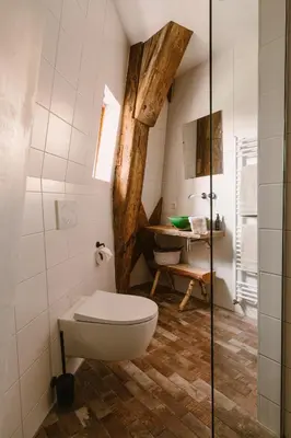 a bathroom with a toilet and a sink at De Molen van Egmond by Droomvilla in Egmond aan den Hoef