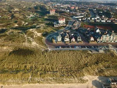 an aerial view of a city with a road at Zeebaars in Egmond aan Zee