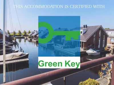 a collage of photos of a marina with the words green key at Tiny houseboat Parel I - airco in Uitgeest