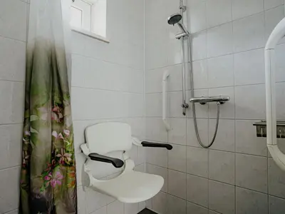 a bathroom with a shower and a toilet in it at Het Kraaijennest Miva in Uitgeest