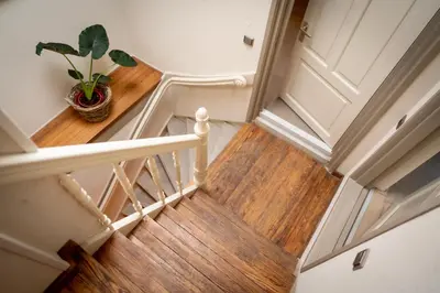 a stairwell with a potted plant on it at Gunnery's Guest House in Alkmaar