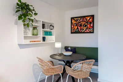 a dining room with a table and chairs at Studio Evership just minutes from the beach and center in Zandvoort