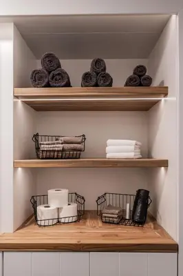 a shelf with towels and other items on it at Huis 8 Studio's in Katwijk aan Zee