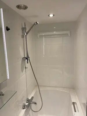 a shower in a bathroom with a bath tub at Apartment Malisa in Zandvoort