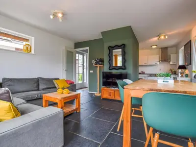 a living room with a couch and a table at Zwaan 24-6 in Breukelen
