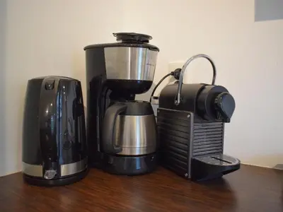 a coffee maker and a blender sitting on a table at Zwaan 24-6 in Breukelen