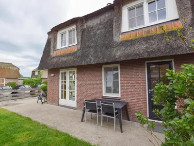 a house with a table and chairs in front of it at Zwaan 24-6 in Breukelen
