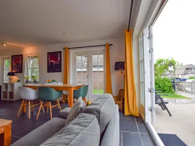 a living room with a couch and a table at Zwaan 24-6 in Breukelen