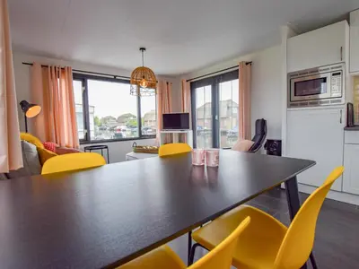 a kitchen and living room with a table and chairs at Blauwborst 24-24 in Breukelen