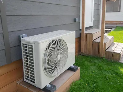 a white fan sitting on the side of a house at Grote Karekiet 24-22 in Breukelen