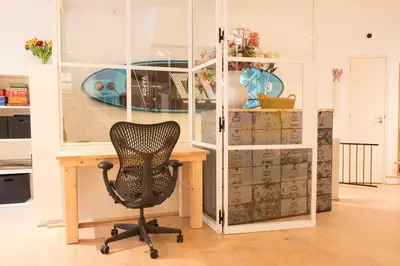 a chair sitting at a desk in a room at Flo's Atelier - Family studio NOTE studio is adjacent to Flo's apartment in Amsterdam