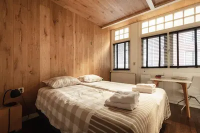 a bedroom with a bed with two towels on it at New! Private Authentic Apartment In City Centre! in Amsterdam