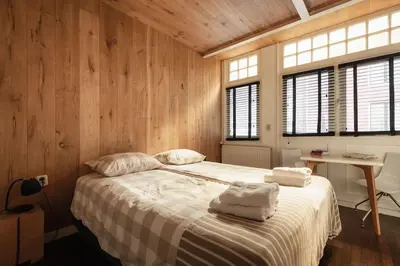a bedroom with a bed with towels on it at New! Private Authentic Apartment In City Centre! in Amsterdam
