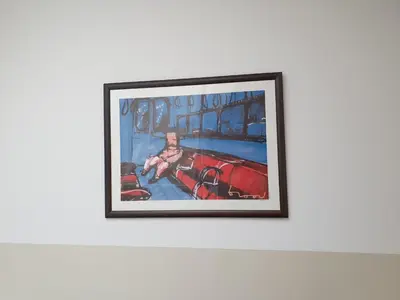a painting of a man in a red car on a wall at Big Room in Amsterdam